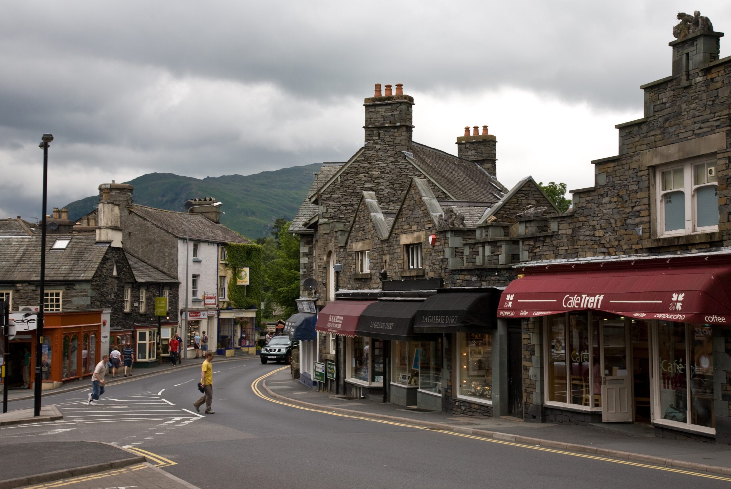 a street with shops and buildings in the background